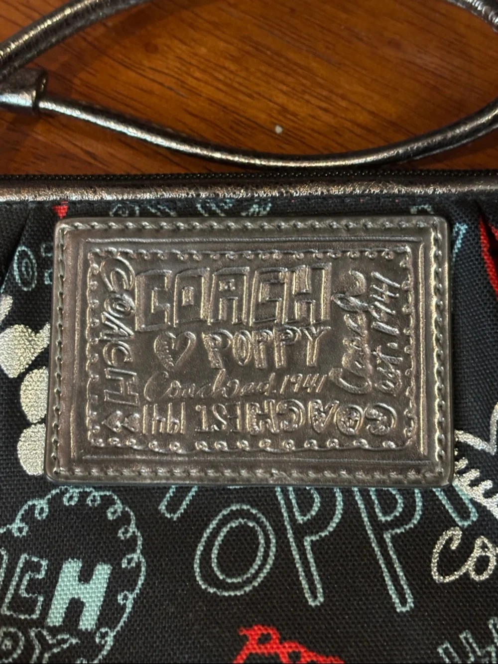 Coach Black Poppy Print Wristlet with Red & Light Blue Accents